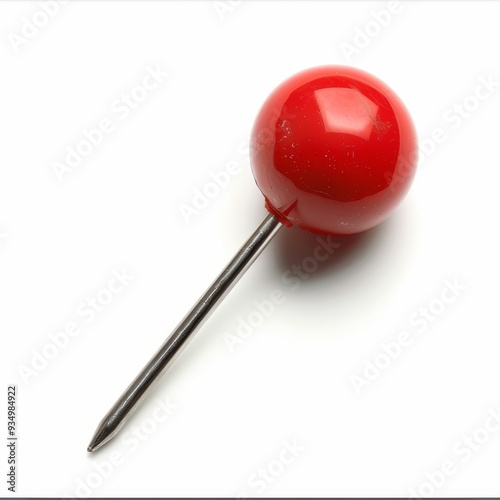 A single red push pin isolated on a white background.