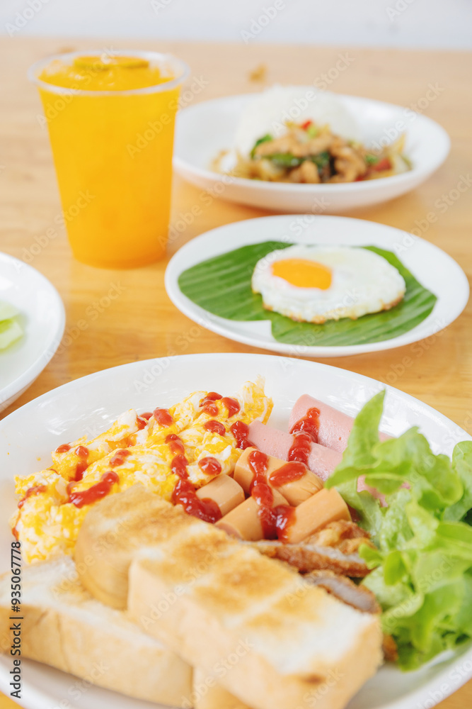 Detailed Breakfast Plate: Toast, Egg, Salad, and a Refreshing Orange Drink, Accompanied by a Parfait for a Well-rounded Morning Meal Detailed Breakfast Plate: Toast, Egg, Salad, and a Refreshing Orange Drink, Accompanied by a Parfait for a Well-rounded Morning Meal