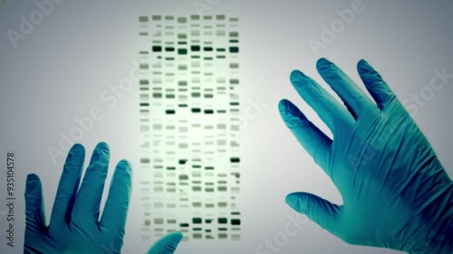 DNA match successful, slides matched up. Close up of blue gloves in criminal justice lab, crime solving genetic genealogy. A laboratory technician compares DNA samples, forensic technology. Cold case.