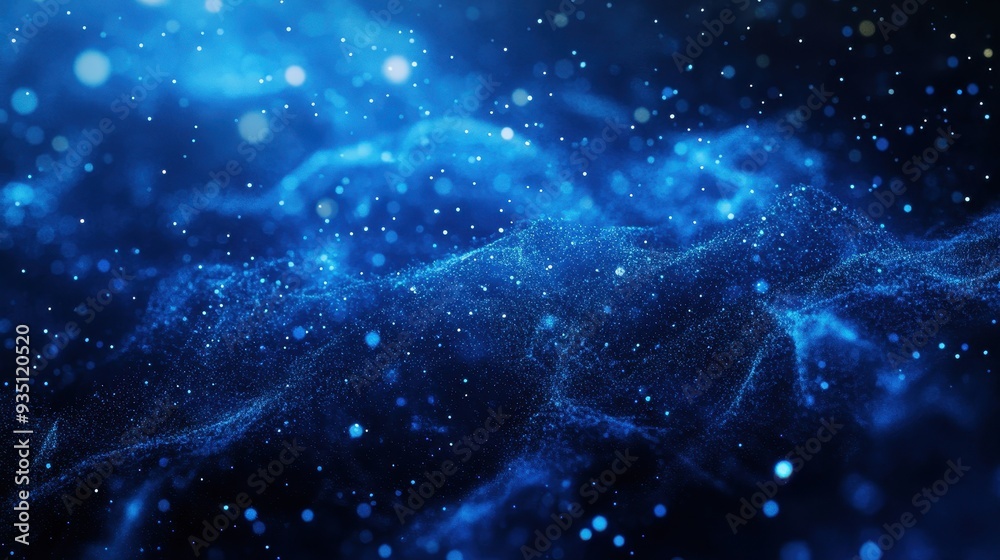 Obraz premium A mesmerizing blue abstract background with glowing particles and waves.