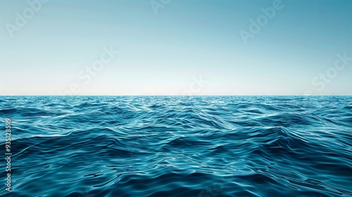 Calm, pale blue sea with a clear sky section for text