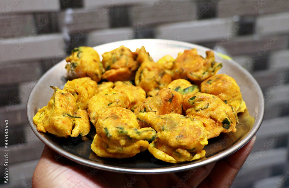 Popular street food item mix bhajiya snacks or Pakoda or Pakora Popular street food item mix bhajiya snacks or Pakoda or Pakora