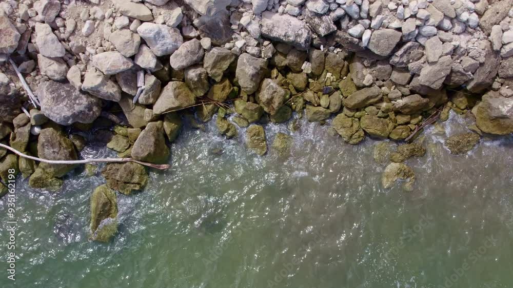 Aerial view of the surf on small rocks Aerial view of the surf on small rocks