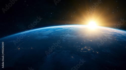 A breathtaking view of Earth from space, capturing the sunrise above the horizon with a backdrop of stars.