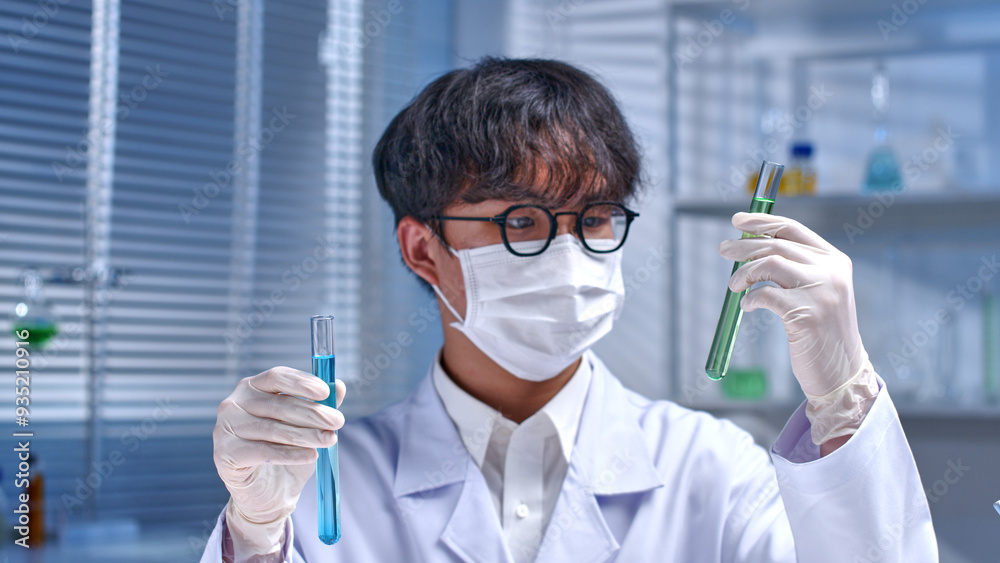 Advertising template photo from front close up view over blurred laboratory background in night time. The researcher is comparing two test tubes contain different color liquid, blank space for text Advertising template photo from front close up view over blurred laboratory background in night time. The researcher is comparing two test tubes contain different color liquid, blank space for text
