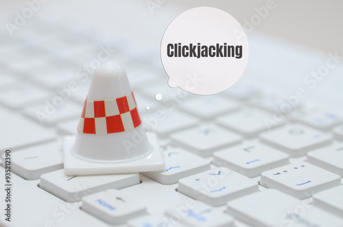 the concept of clickjacking, where malicious actors trick users into clicking on hidden elements, symbolizing the hidden dangers that lurk online. photo