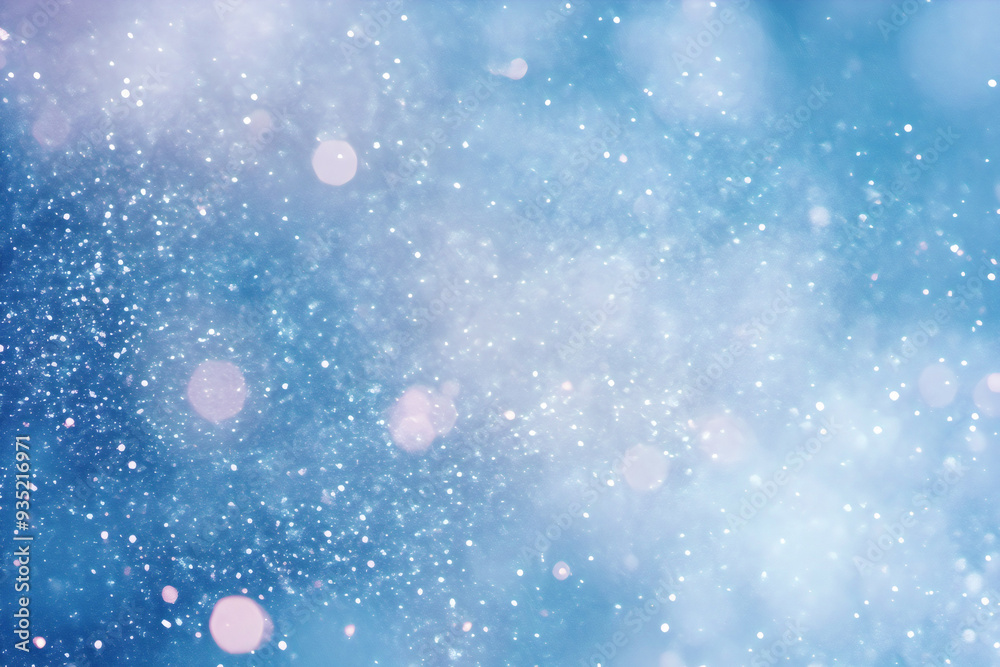 Abstract background with glittering particles and bokeh lights creating a festive atmosphere