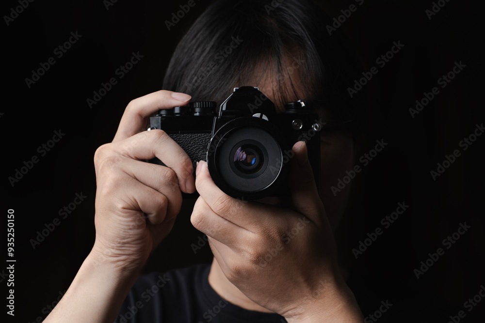photographer take pictures Snapshot with camera. man hand holding with camera looking through lens.Concept for photographing articles Professionally. photographer take pictures Snapshot with camera. man hand holding with camera looking through lens.Concept for photographing articles Professionally.