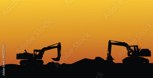 silhouette of an excavator digging the ground with a sunset background 