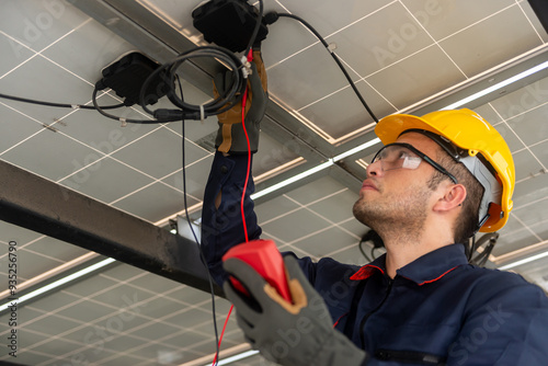 Engineer technical service checking solar panel with electricity meter for check the voltage, checking the system work properly