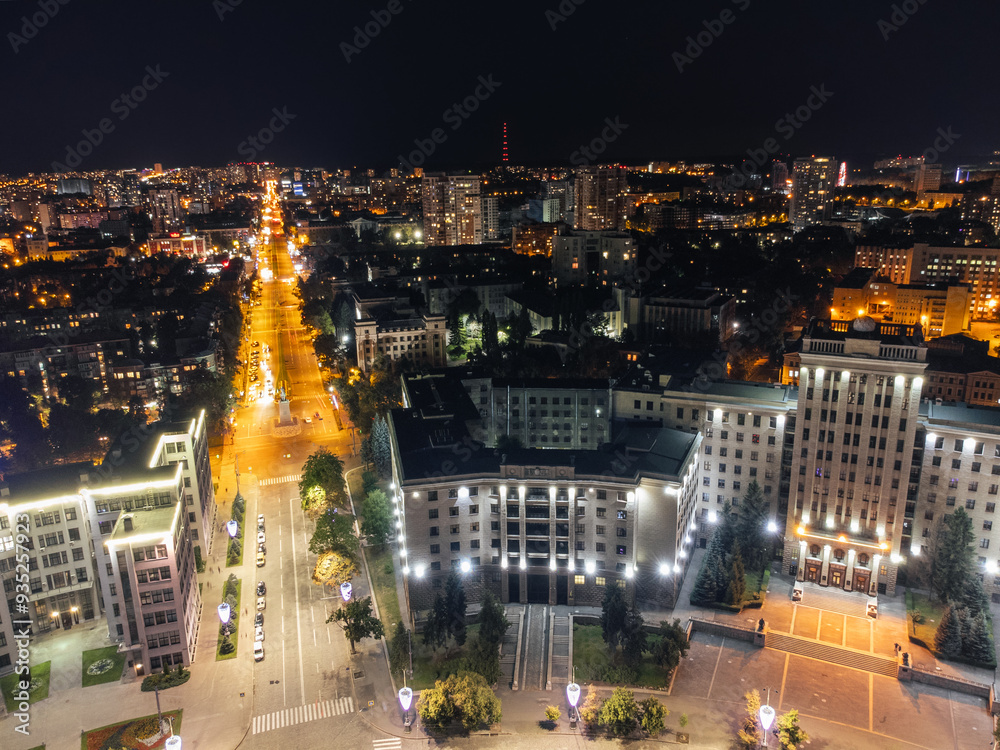 Obraz premium Aerial nighttime illuminated University building on Kharkiv city center streets