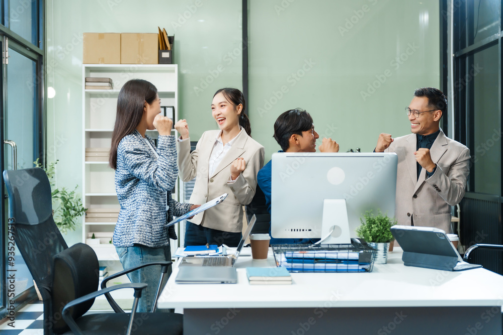 In an office, an Asian team meets at a desk, analyzing financial data on a monitor. They discuss business finance, operational guidelines, and strategies for success, data-driven decision-making. In an office, an Asian team meets at a desk, analyzing financial data on a monitor. They discuss business finance, operational guidelines, and strategies for success, data-driven decision-making.