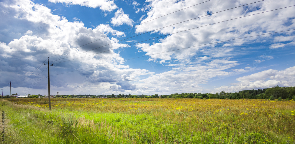 A lush, golden meadow stretches under a dynamic sky filled with fluffy clouds, capturing the essence of a tranquil countryside in full bloom. A lush, golden meadow stretches under a dynamic sky filled with fluffy clouds, capturing the essence of a tranquil countryside in full bloom.