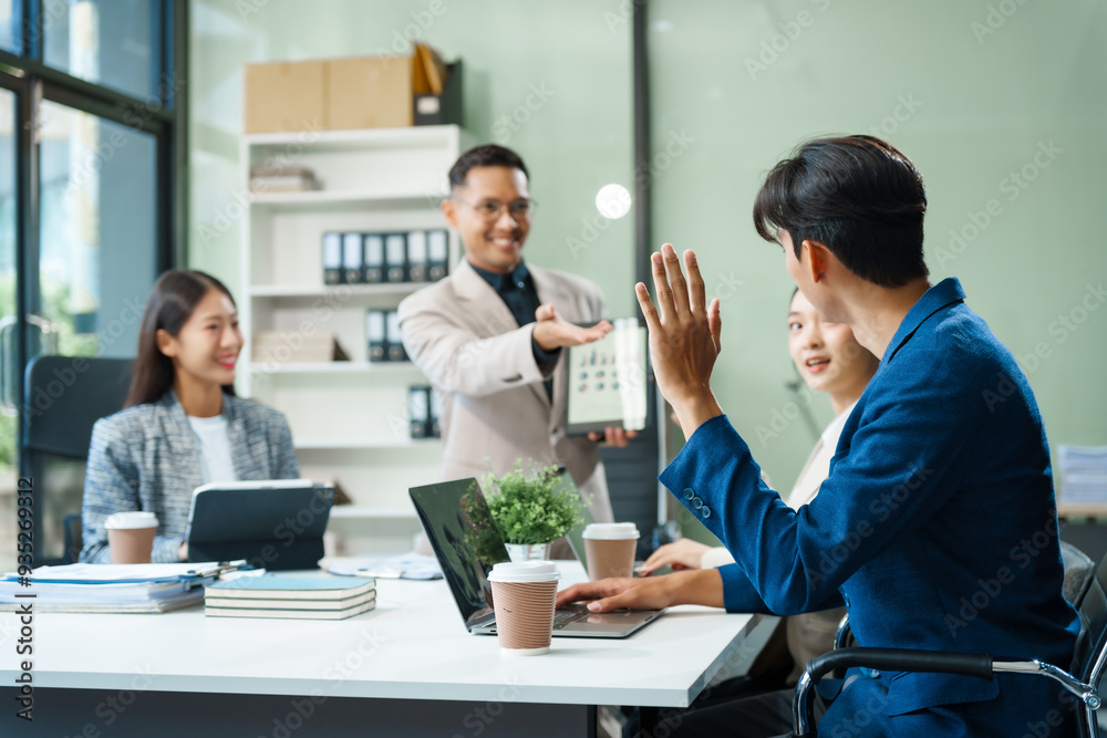 In a boardroom, an Asian team meets at a desk, presenting financial terms and strategies. Executives and employees collaborate, sharing ideas and work guidelines for success during an annual meeting. In a boardroom, an Asian team meets at a desk, presenting financial terms and strategies. Executives and employees collaborate, sharing ideas and work guidelines for success during an annual meeting.