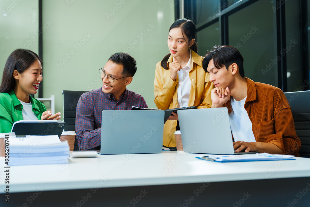 In a boardroom, an Asian team discusses startup financials and business terms. They present strategies on acquisitions, cash flow, and investor relations, innovative approaches for company growth. In a boardroom, an Asian team discusses startup financials and business terms. They present strategies on acquisitions, cash flow, and investor relations, innovative approaches for company growth.