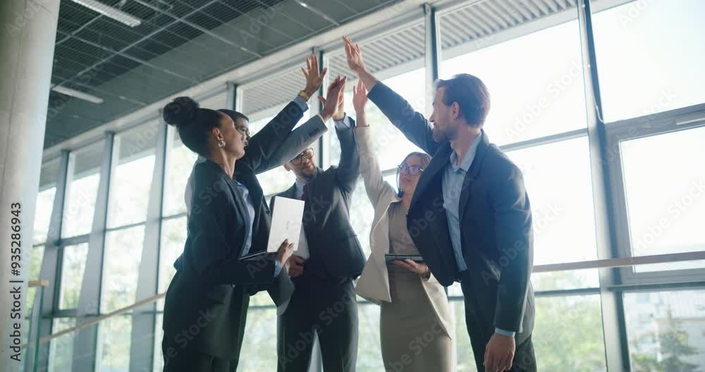 Modern Multiethnic Office Meeting: Motivated Businesspeople Discussing Financial Strategy with Partners and Pitching New Ideas. Diverse Team of Men and Women Doing a High Five Together Modern Multiethnic Office Meeting: Motivated Businesspeople Discussing Financial Strategy with Partners and Pitching New Ideas. Diverse Team of Men and Women Doing a High Five Together