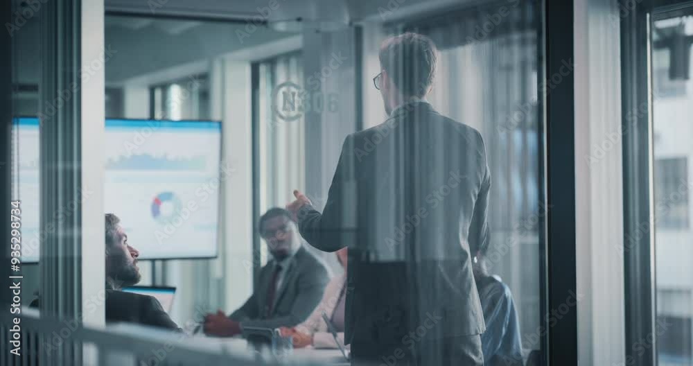 Manager Pitching a New Product with a Presentation to a Board of Directors in a Meeting Room in the Office. Young Executive Using a Digital Interactive Whiteboard to Show Projected Sales and Revenue Manager Pitching a New Product with a Presentation to a Board of Directors in a Meeting Room in the Office. Young Executive Using a Digital Interactive Whiteboard to Show Projected Sales and Revenue