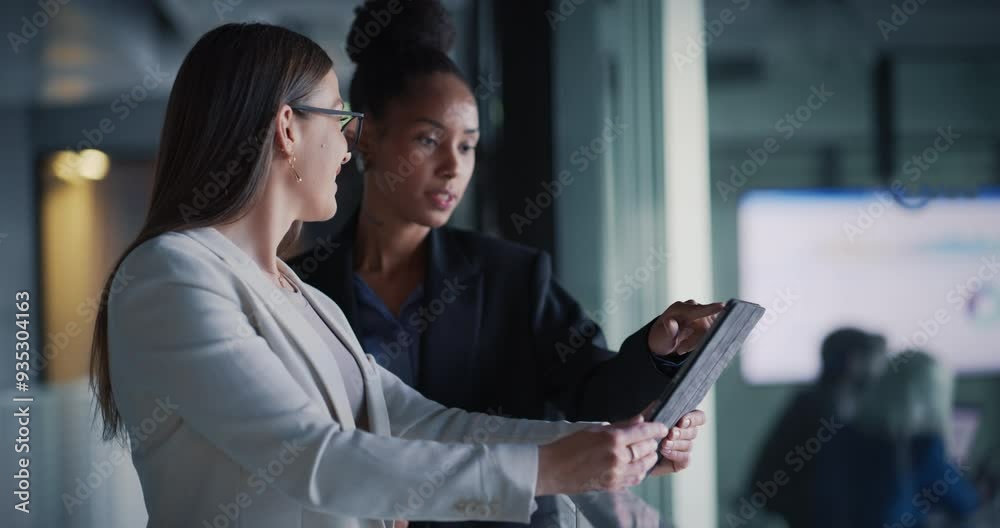 Elegant and Empowered Businesswomen Standing on a Balcony in a Bright Office Building, Using Tablet Computer and Discussing Business Opportunities. Smart Confident Women Having a Quick Meeting at Work Elegant and Empowered Businesswomen Standing on a Balcony in a Bright Office Building, Using Tablet Computer and Discussing Business Opportunities. Smart Confident Women Having a Quick Meeting at Work