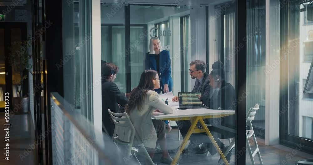 Team of Female and Male Managers Having a Discussion in an Office Meeting Room. Private Equity Businesspeople Analyzing Financial Reports, Planning Future Acquisitions, Brainstorming New Ideas