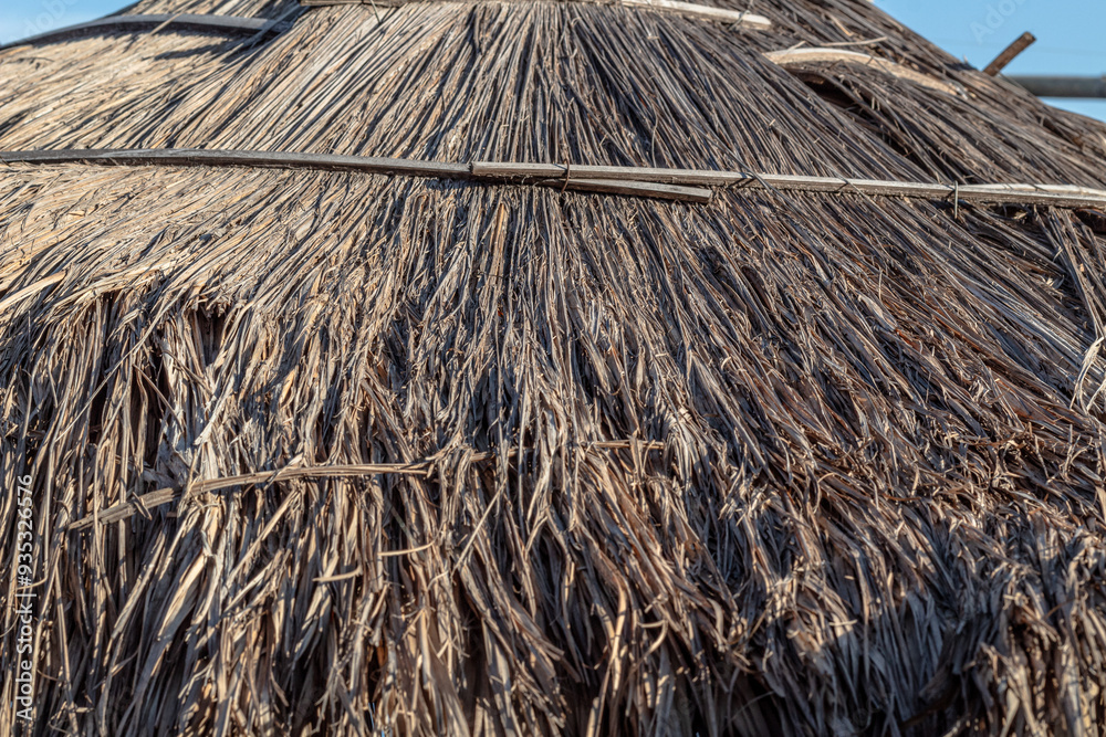 Fototapeta premium The roof texture is made of woven straw