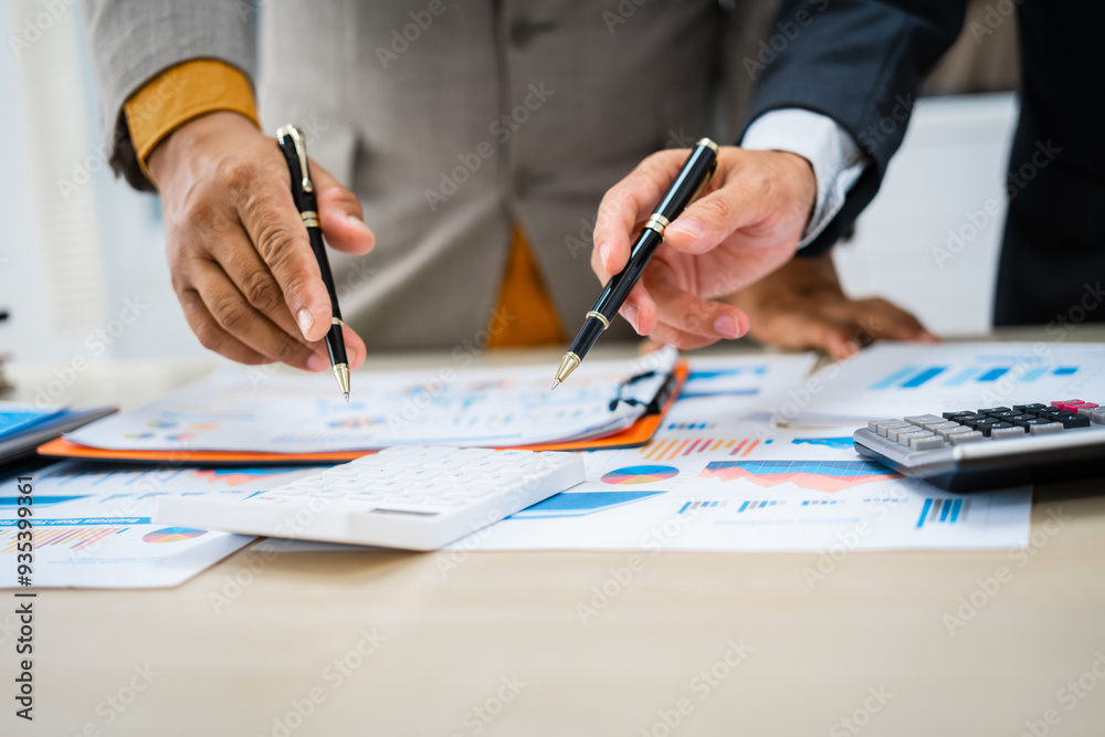 close-up of two professionals' hands meeting at a desk, discussing business strategies over a digital tablet and laptop. teamwork, planning, and communication in a corporate office setting. close-up of two professionals' hands meeting at a desk, discussing business strategies over a digital tablet and laptop. teamwork, planning, and communication in a corporate office setting.