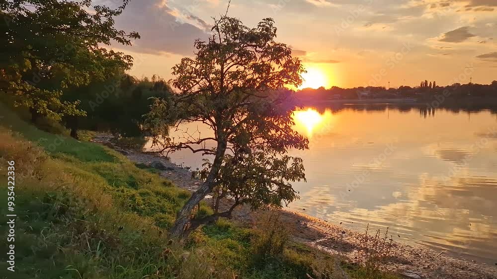 Beautiful sunset at the lake. Warm summer season evening Beautiful sunset at the lake. Warm summer season evening