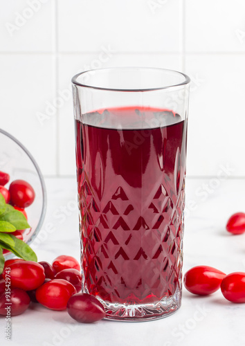 Wallpaper Mural Glass of healthy dogwood berry drink on light background. Turkish name; Kizilcik serbeti Torontodigital.ca