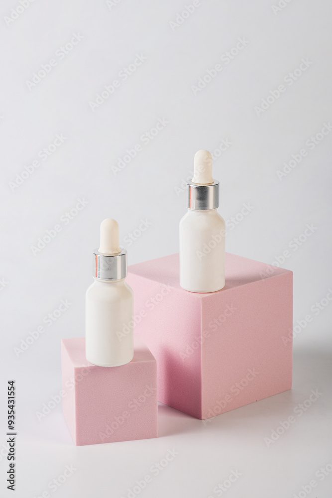 White glass cosmetic bottle in hand, Skin care or sunscreen cosmetic with stylish props on white background. White glass cosmetic bottle in hand, Skin care or sunscreen cosmetic with stylish props on white background.
