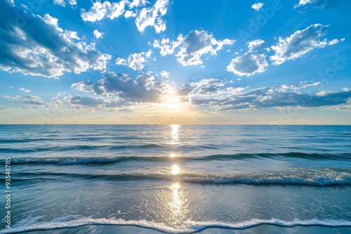 Sunset beach  blue sky, white clouds, endless sea, reflective ripples, and nature s mystical beauty photo