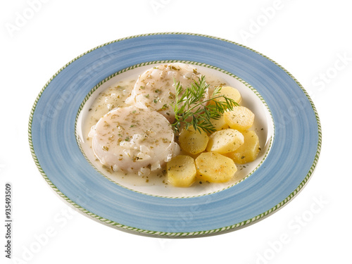 Merluza en salsa con patatas hervidas y perejil. Hake in sauce with boiled potatoes and parsley.