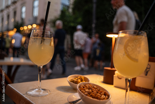 Obraz na płótnie Limoncello spritz drink of liqueur, sparkling wine and lemon in cocktail glass w salonie