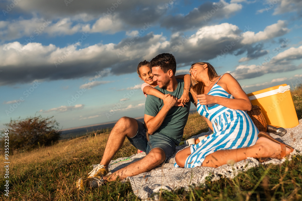 A happy family spends a sunny day embracing nature and soaking up the last rays of the sun in the summer A happy family spends a sunny day embracing nature and soaking up the last rays of the sun in the summer