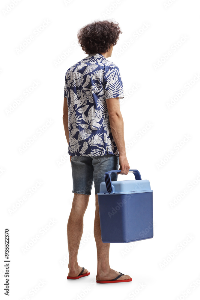 Rear view show of a guy holding a portable mini fridge Rear view show of a guy holding a portable mini fridge