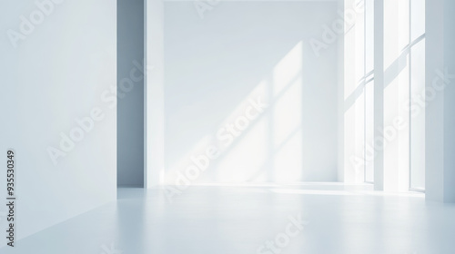 Bright empty white room with large windows casting soft sunlight onto the clean floor. The minimalist interior design highlights open space and simplicity.