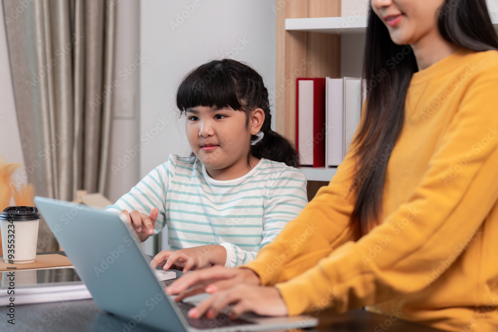 Mother and daughter bonding over shared laptop activities Mother and daughter bonding over shared laptop activities