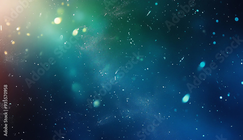 Abstract blue and green gradient background with light and dust particles.