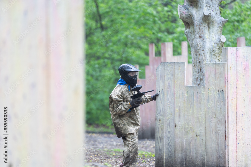 Fototapeta premium kids team play paintball on the field 