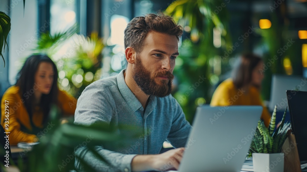 A team of colleagues working together in an open office, focusing on a shared business goal. A team of colleagues working together in an open office, focusing on a shared business goal.