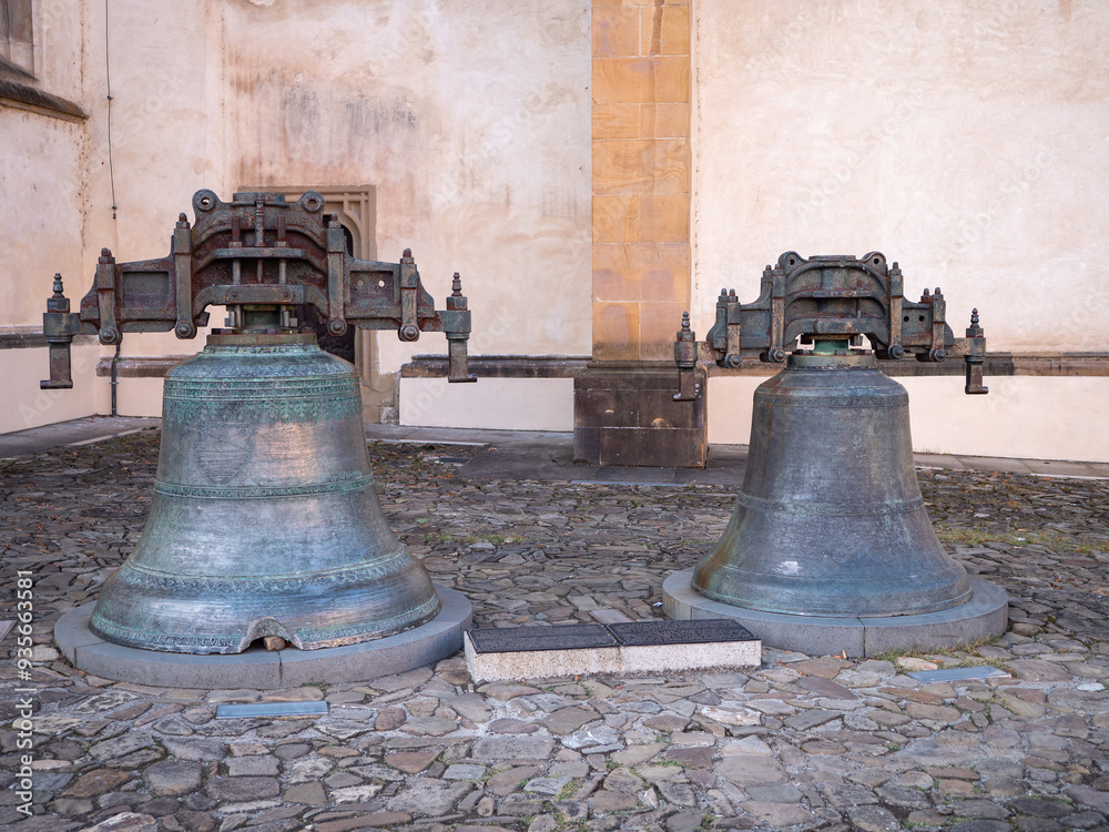 Obraz premium Old cracked historical bells: Ján from 1486 and Urban from 1584 at the Church of St. Aegis on the Town Hall Square in Bardejov.