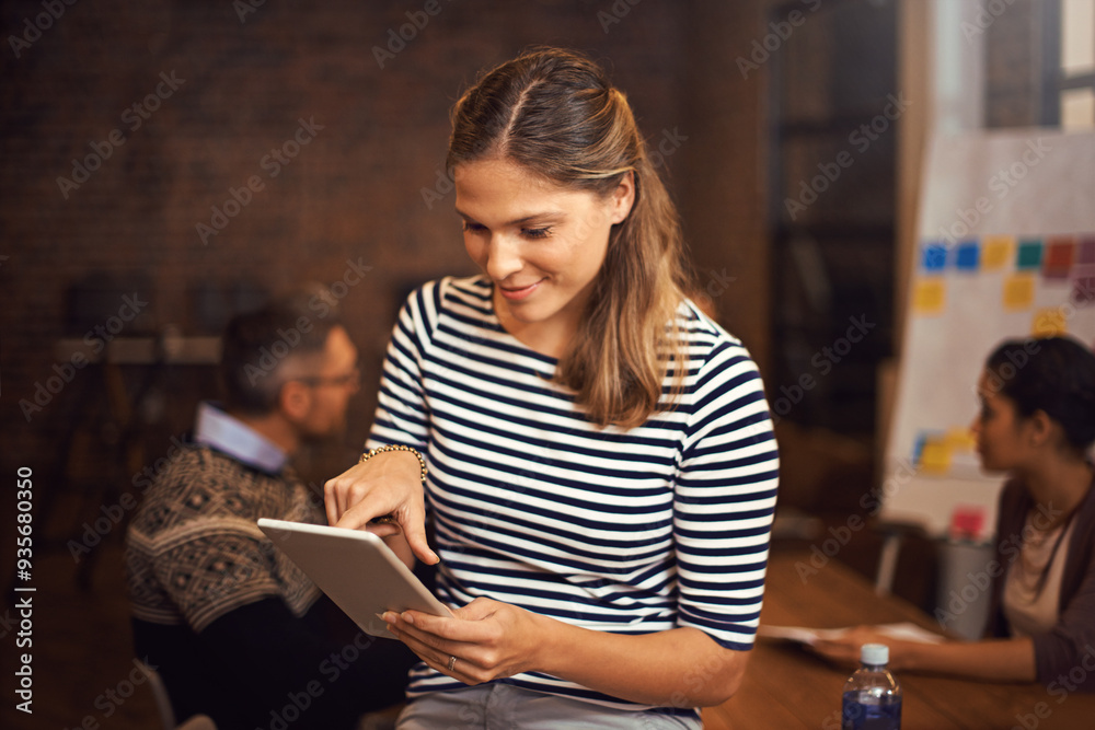 Research, tablet and business woman with email, internet or review info with team in office meeting. Technology, reading or creative worker check app in startup with publisher planning project online Research, tablet and business woman with email, internet or review info with team in office meeting. Technology, reading or creative worker check app in startup with publisher planning project online