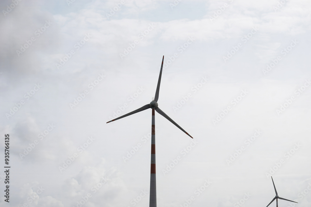Kharedi, Gujarat, Indian-08-08-2024: Sustainable Energy: The Integral Presence of Wind Turbines in Farming Areas Kharedi, Gujarat, Indian-08-08-2024: Sustainable Energy: The Integral Presence of Wind Turbines in Farming Areas