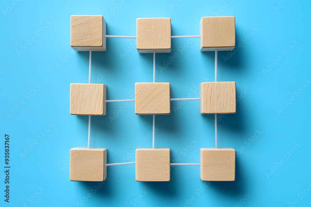 Teamwork and cooperation symbolized by wooden blocks being assembled in a collaborative Teamwork and cooperation symbolized by wooden blocks being assembled in a collaborative