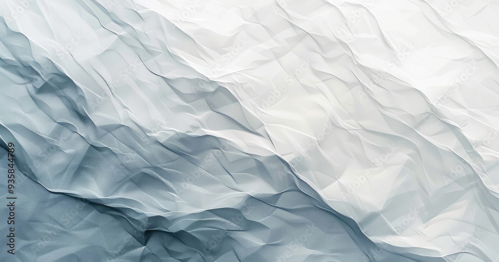 Obraz premium A textured abstract background with soft, crumpled layers in shades of white and blue, evoking a sense of calm and serenity.
