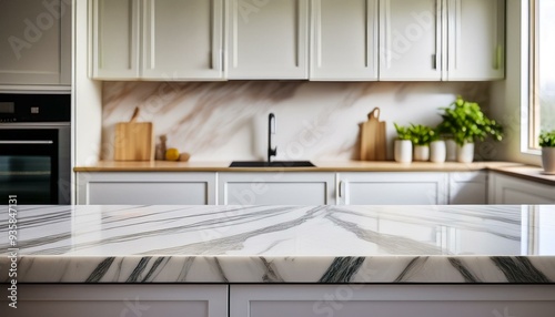 a bright kitchen with a large marble bench as the focus in the foreground and the background