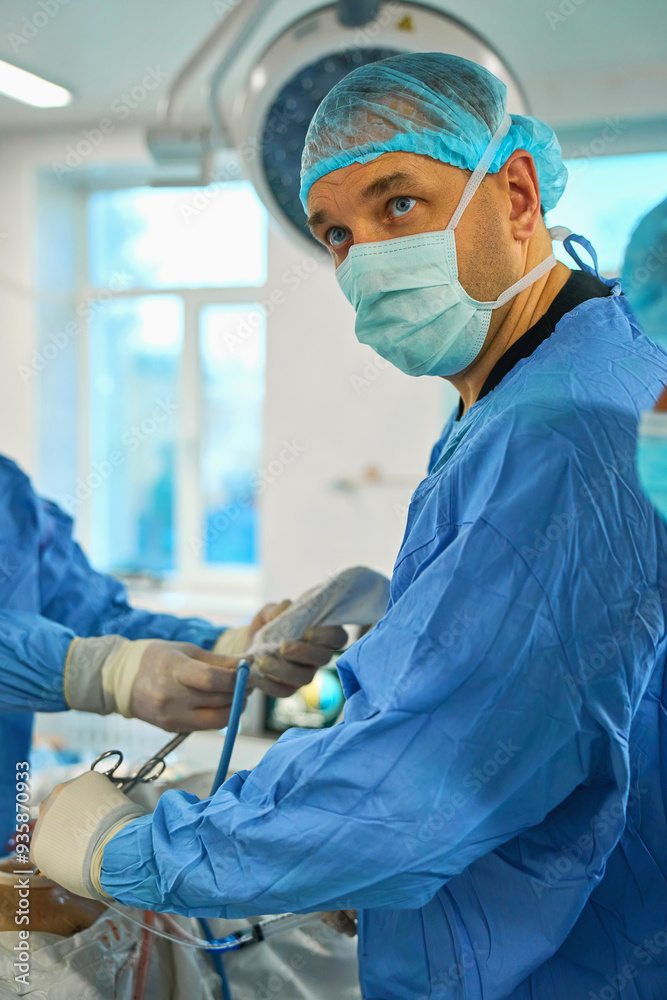 The surgeon operates on the patient under anesthesia The surgeon operates on the patient under anesthesia
