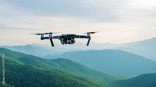 Drone Flying Over Majestic Mountains - A drone with a camera soars through the air above a stunning mountain range. The concept of aerial photography, technology, nature, exploration, and freedom are 