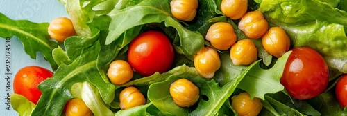 Fresh and Healthy Salad with Chickpeas, Tomatoes, and Arugula - A close-up shot of a vibrant salad featuring fresh arugula, cherry tomatoes, and golden chickpeas, symbolizing healthy eating, vegetaria photo