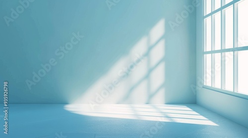 Empty blue room bathed in soft sunlight through large windows, creating a minimalist and serene atmosphere.