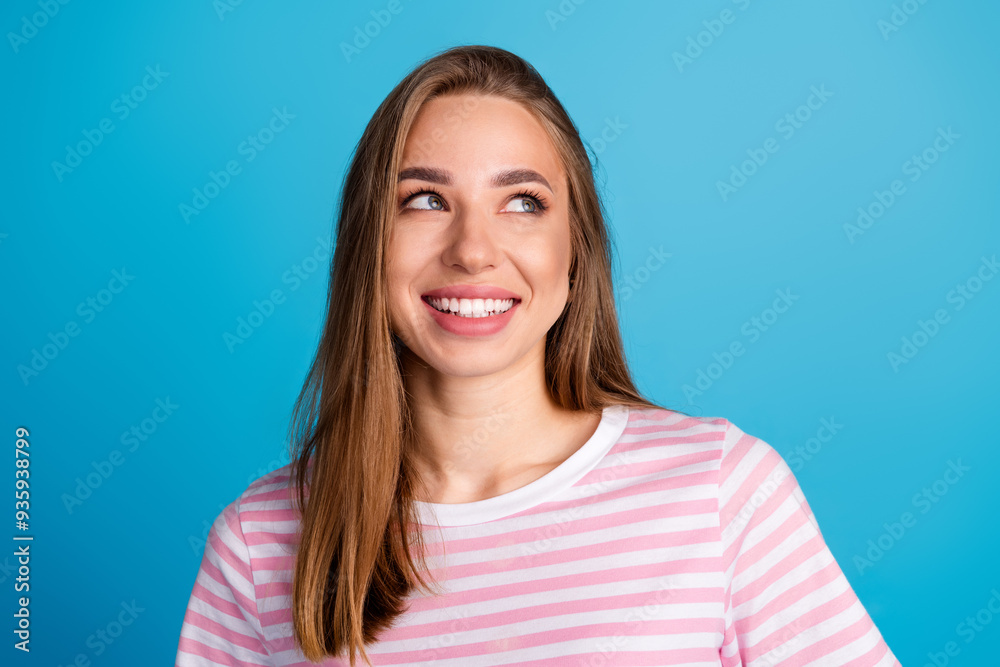 Photo of lovely cute nice woman wear stylish pink clothes look empty space isolated on blue color background Photo of lovely cute nice woman wear stylish pink clothes look empty space isolated on blue color background