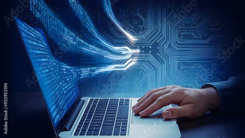 A portrait of a software engineer hand on a laptop trackpad with binary code from the laptop screen into a digital circuit board innovation in software engineering